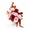 Pink and burgundy flowers arranged in a white vase with orange leaves