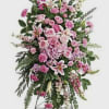 Tall pink floral standing spray on an easel