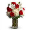 Bouquet of red roses, white lilies, and white hydrangeas in a clear glass vase