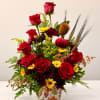 Red roses and yellow chrysanthemums in a vase with fall accents
