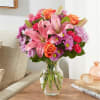 A carefully selected blend of roses, daisies,
and lilies make for a truly
