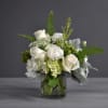 White and green hydrangeas, white roses, ranunculus, green hypericum, dusty miller and