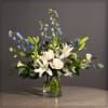 Delphinium, Lillies, Thistle, Campanula and Snapdragons with Premium Greens in a unique