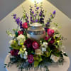 Urn Surround with purple larkspur framing the back, lavender roses, green orchids