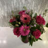 Pink roses and gerbera daisies in a vase