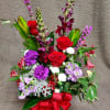 Flowers will vary, in gorgeous shades meant for love this Valentine's day.