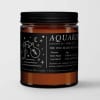 Amber candle in a black-lidded jar with an Aquarius label