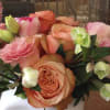Roses and Helleborus in a white ceramic vase