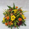Choose this beautiful fall centerpiece that features a mix of chrysathemums and
