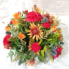 Select this rounded centerpieces of carnations, spray roses and chrysathemums that is