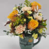 Select this unique fall themed arrangement designed in a cute pumpkin mug.