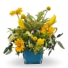Yellow mixed bouquet in a blue square vase