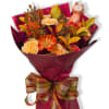 Bouquet of orange and cream flowers with a small fox figurine