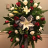   A beautiful easel spray with red and white flowers and