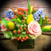 CHEERFUL MIX ARRANGEMENT WITH PINK ROSES, YELLOW TULIPS,ORANGE HYPERICUM, BLUE HYACINTH, AND