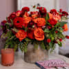 This fiery floral arrangement is a vibrant autumn hue. Rich, velvety red