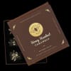 Box of honey hazelnut caramels with a brown lid and black tray