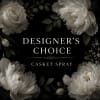 White floral casket spray with roses and peonies on a black background