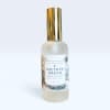 Bottle of room and linen spray with a gold cap