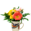Mixed flowers arranged in a bird-printed mug