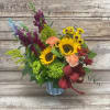 Sunflower bouquet with snapdragons and carnations in a metal vase
