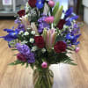 Purple iris ,lavender stock,red rosas,white Mintecasino,leather lives 