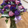 fresh flowers include 
purple roses, purple satic flowers, ,stock and carnation purple