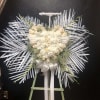 White roses ,white carnation .babys breath palms 