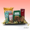 Gift tray with assorted snack packages and a cheese spread box