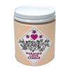 Beige candle in a glass jar with a pink heart label