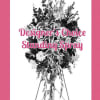 Standing spray on an easel with mixed flowers and greenery