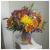 Bright seasonal mix with vibrant tulle in a vase 