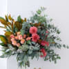 Pink and peach bouquet in a clear glass vase