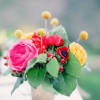 Small bouquet of colorful flowers in a wrapped container