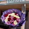 This enchanting arrangement combines 8 pure white roses, 5 red roses, and