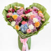 Mixed bouquet of roses, chrysanthemums, hydrangeas, and carnations wrapped in green paper