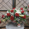 Red roses and white lilies in a glass vase
