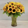 Brighten up anyone's day with this beautiful arrangement of sunflowers and seasonal