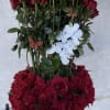 100 RED ROSES BEAUTIFULY DESIGNED IN A STONE VASE WITH BUTTERFLIES AND