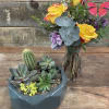 Succulent planter and vase of yellow roses with butterfly picks
