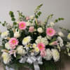Large bouquet of pink and white flowers with a silver ribbon