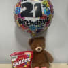 Birthday balloon with a teddy bear and a bag of Skittles candy