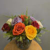 Colorful rose bouquet in a glass vase