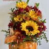 Adorable keepsake pumpkin cookie jar filled with sunflowers and fall colors. 