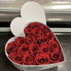 Heart-shaped box filled with red roses