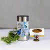 Memorial candle with floral butterfly design and a small greenery sprig