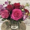 Pink and red rose bouquet in a clear glass vase