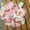 Pink and white bridal bouquet with roses and orchids