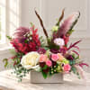 Mixed floral arrangement in a rectangular box with pink, white, and burgundy blooms