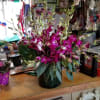 Dendrobium orchids are done in the cylinder vase